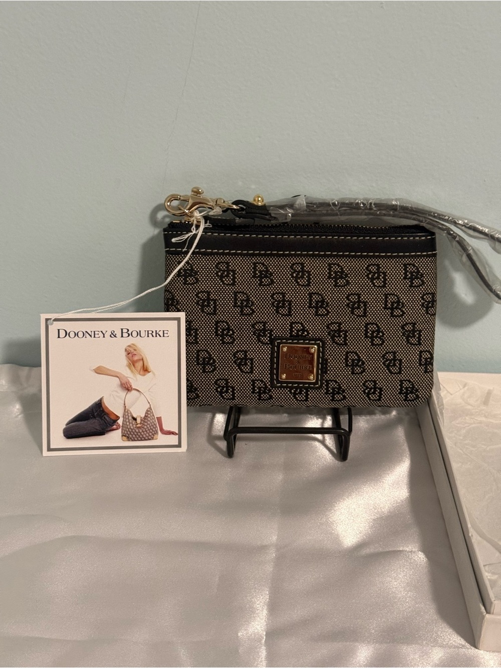 Dooney and Bourke NWT Medium logo wristlet. Comes in a box!